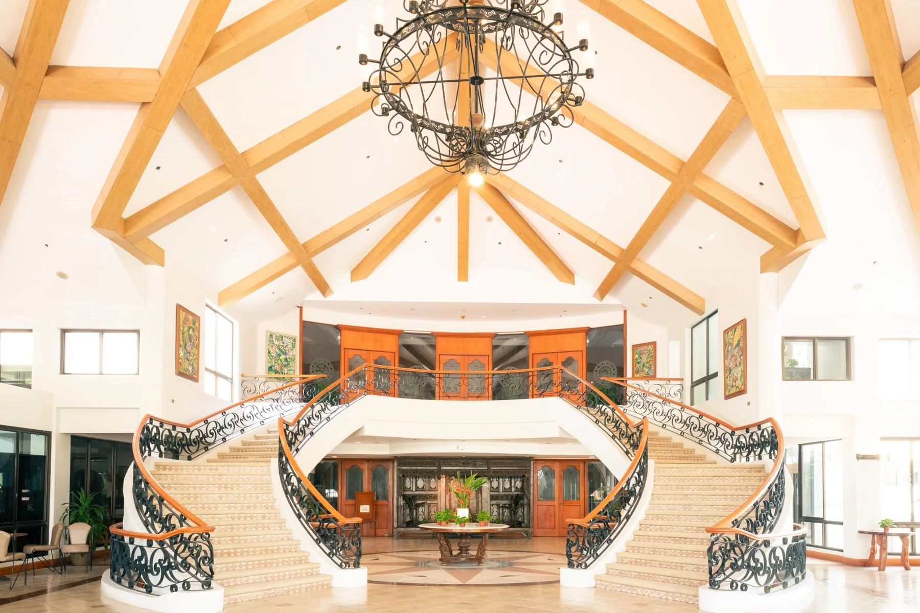 The grand lobby and staircase at Xavier Sports & Country Club