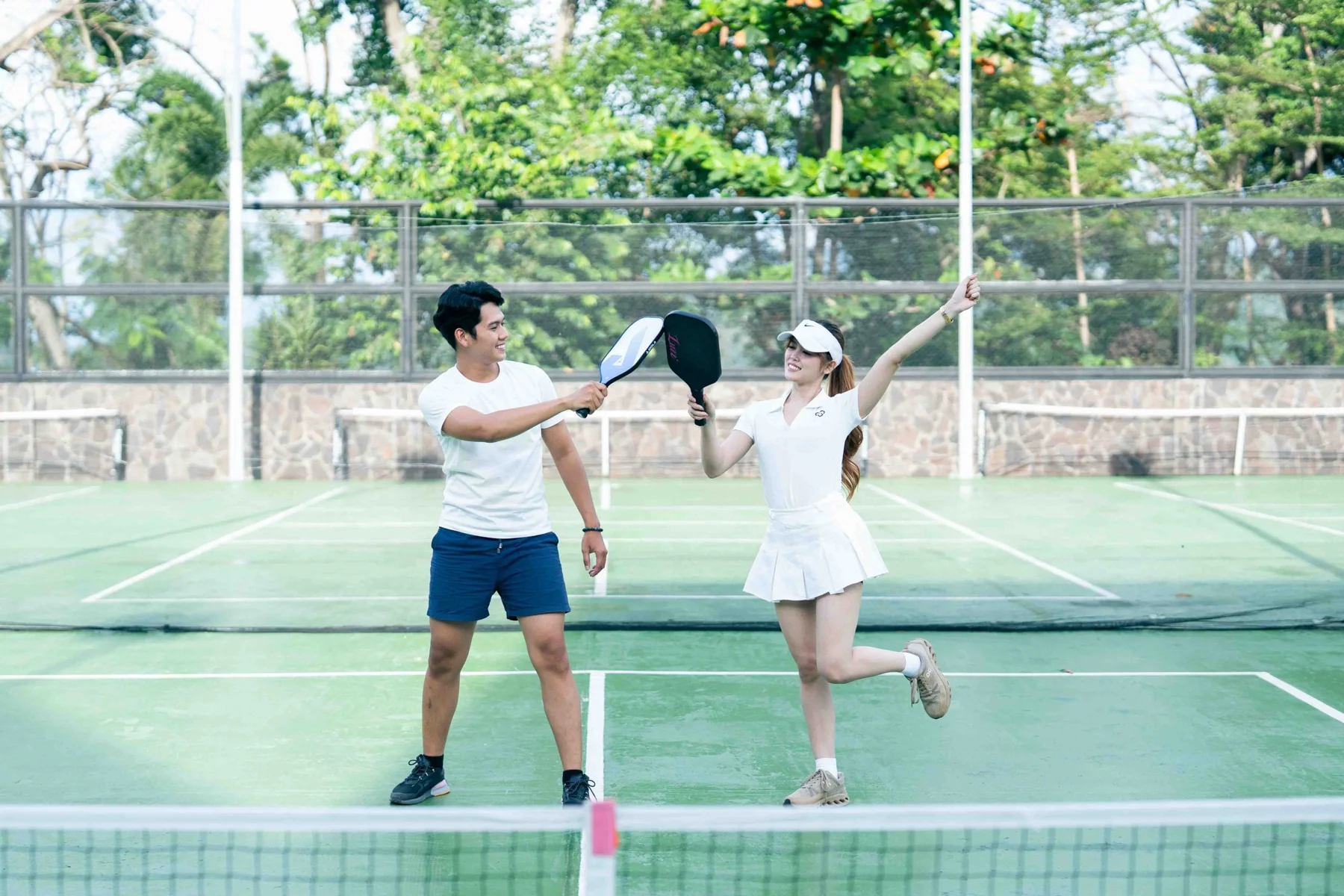 A family playing pickleball together